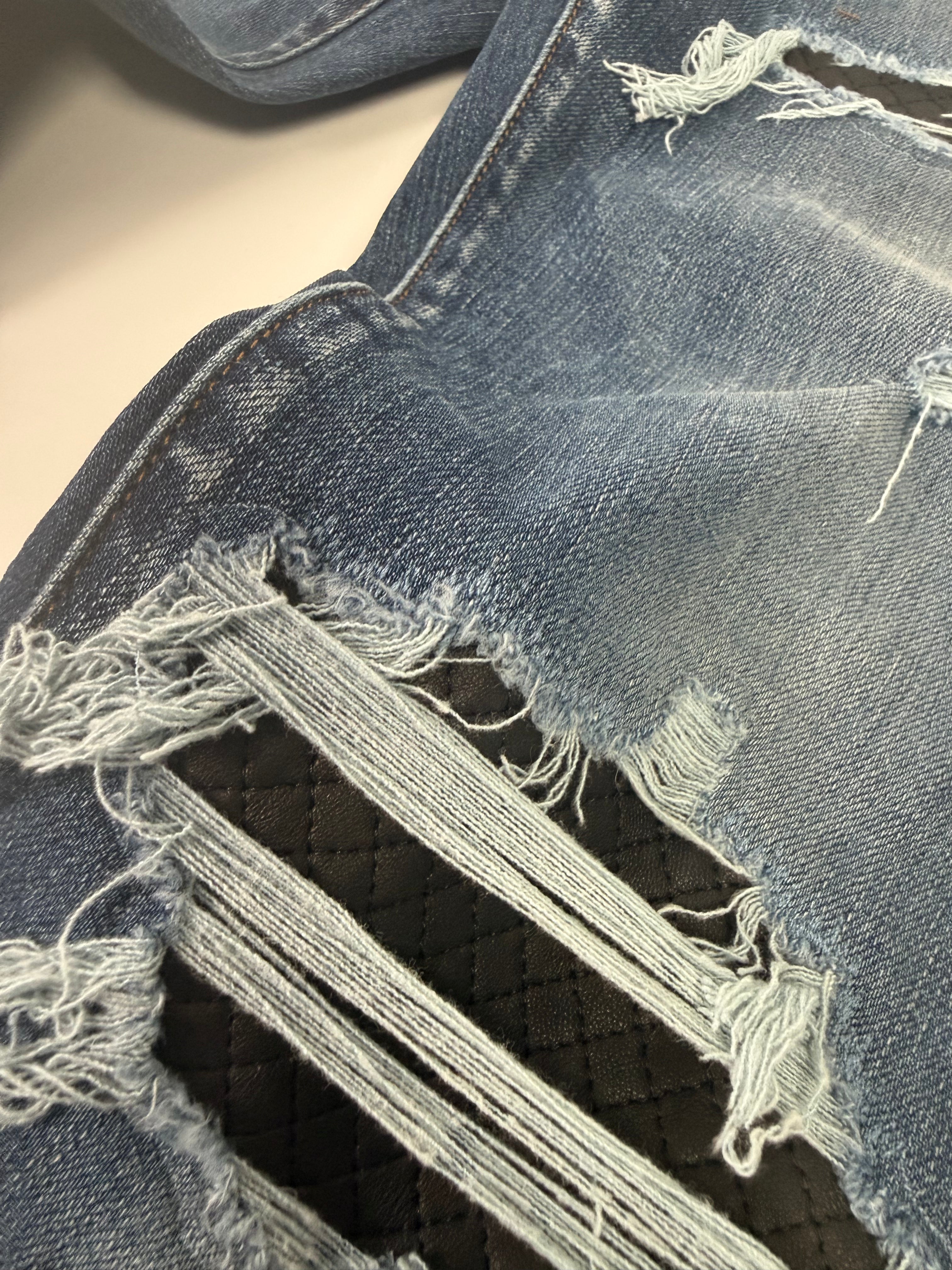 Amiri Ripped Blue Jeans